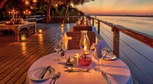 <img src="sunset-on-chobe-game-lodge-deck.jpg" alt=”chobe safari escape from victoria falls accommodated in finest chobe lodge">
